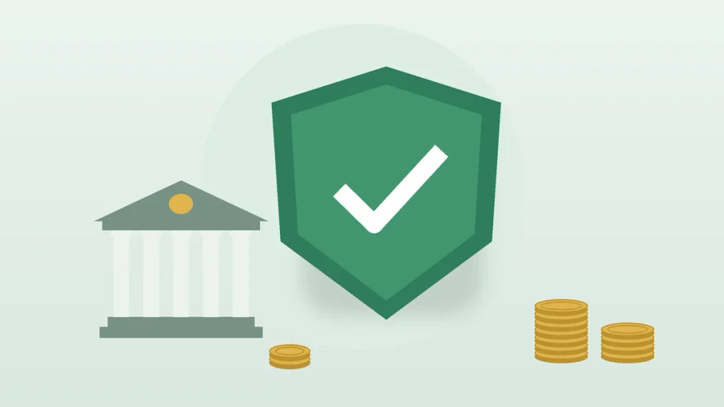 Shield with a check mark beside a bank, showing money market accounts are safe with FDIC insurance