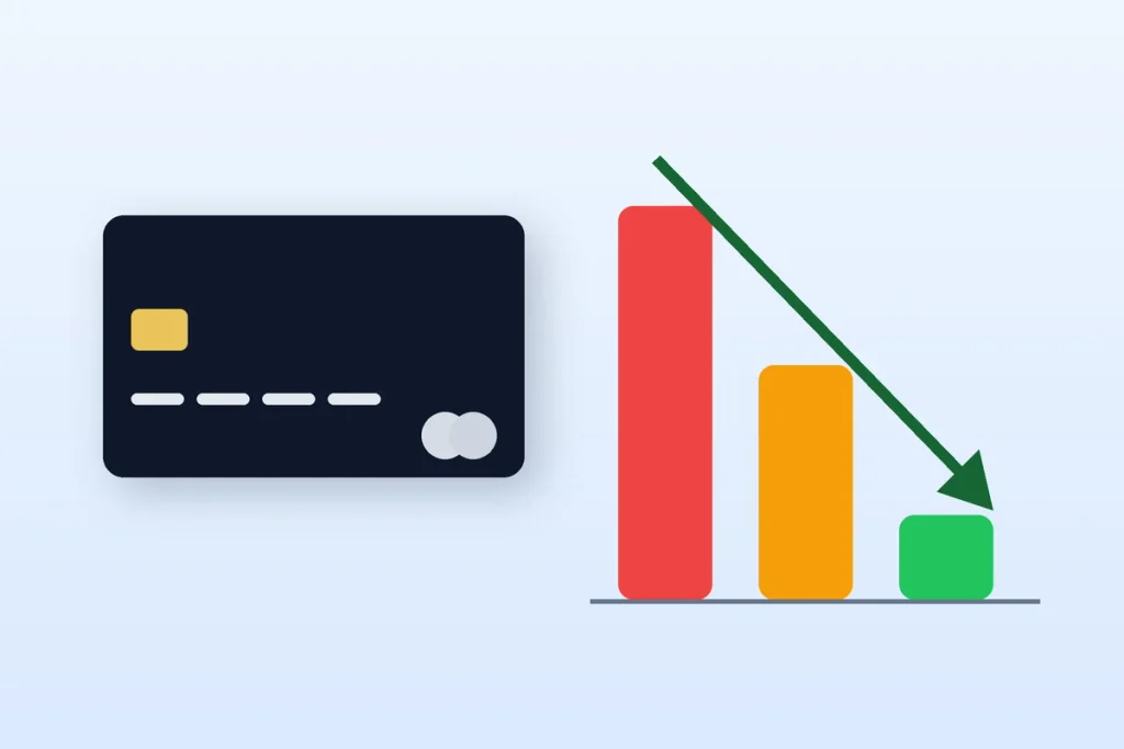 Credit card beside a falling bar chart showing a lower credit utilization ratio