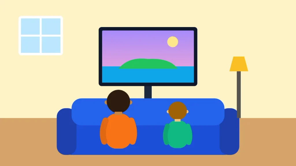 Parent and child playing Fortnite for beginners together on a couch in front of a TV